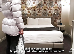 Stepmother plus stepson share a bed in a hotel room